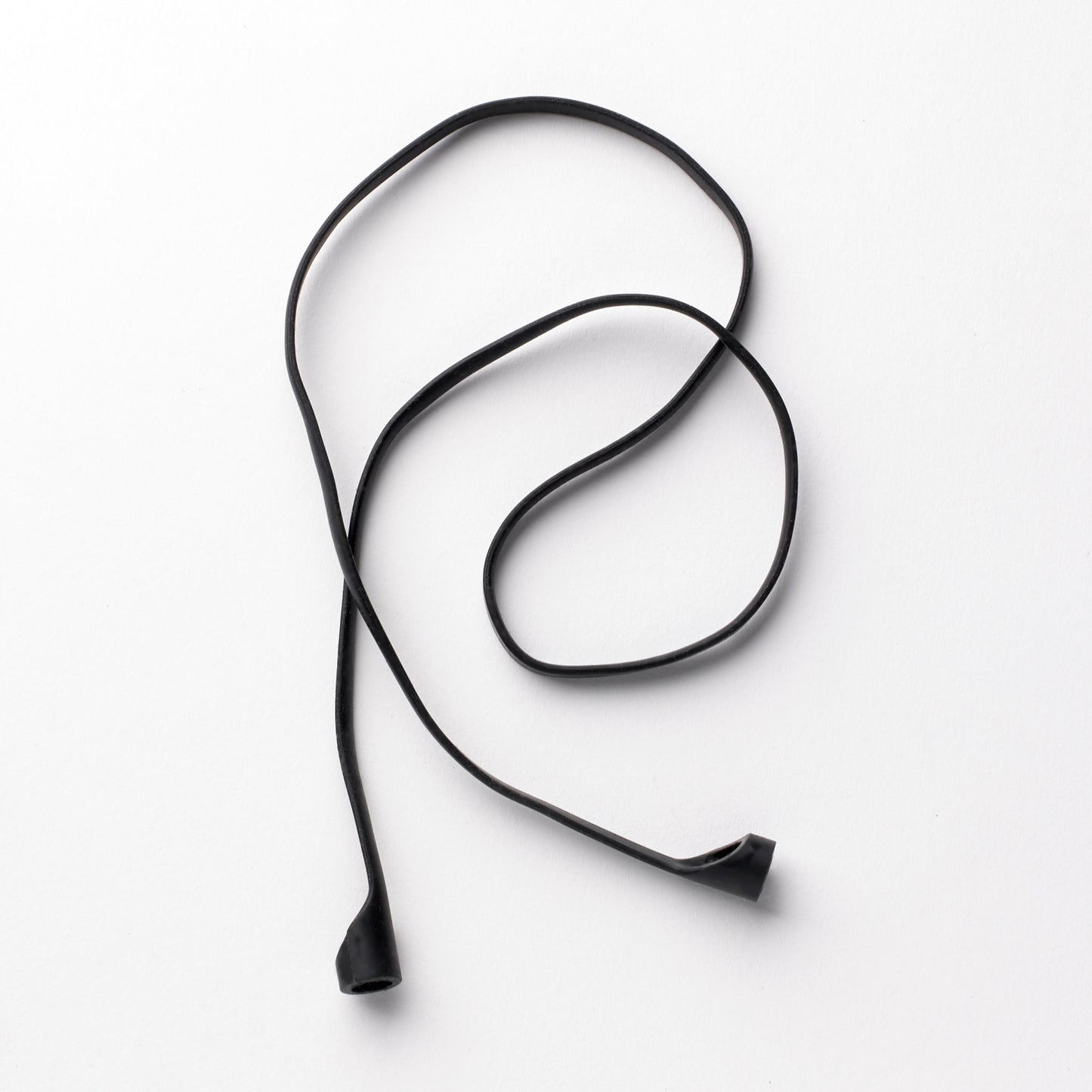 Black rubber earplug cord elegantly displayed, highlighting its sleek design and flexibility for easy handling and storage.